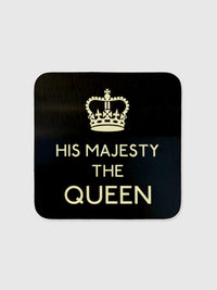 A black square glossy coaster with rounded edges featuring the text 'His Majesty The Queen' in white.