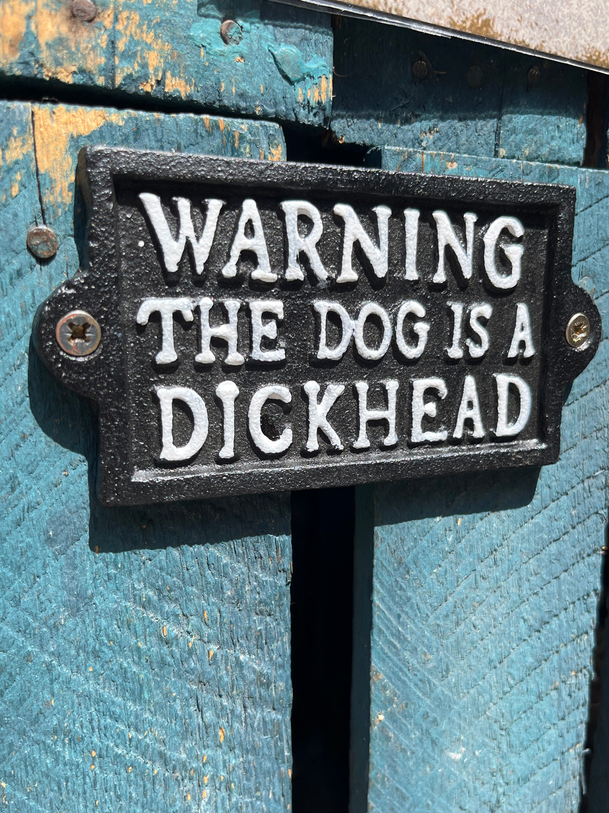 The dog is a dickhead- Cast Iron Sign