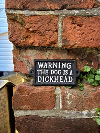 The dog is a dickhead- Cast Iron Sign